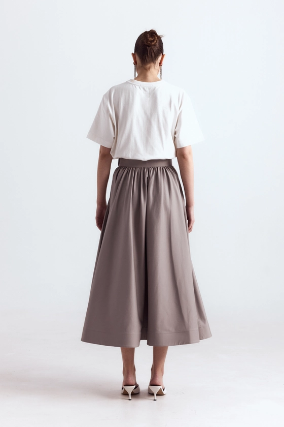 Спідниця-кльош міді з косими кишенями 