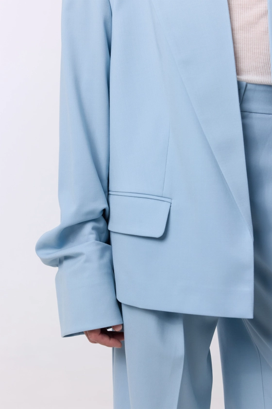 Oversized wool blazer with gathering on the sleeve - photo 7