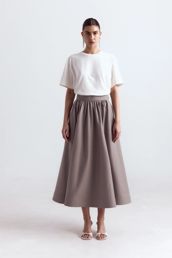 Спідниця-кльош міді з косими кишенями 