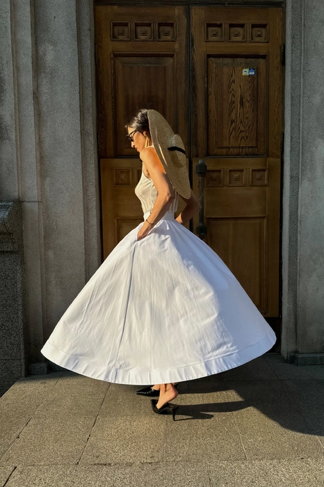 Спідниця-кльош міді з косими кишенями