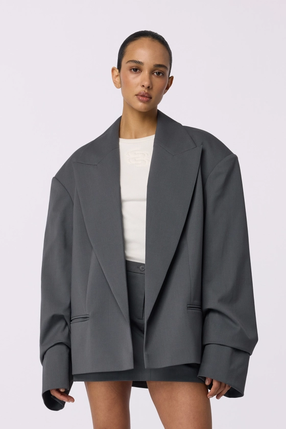 Oversized wool blazer with gathering on the sleeve - photo 4
